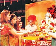 Former Miss World and Indian actress Aishwarya Rai performing Aarti on an idol of the demon Ganapati