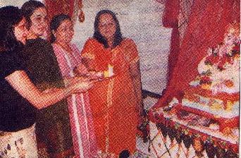 Former Indian actress Padmini Kolhapure performs the 'Aarti' upon an idol of the demon Ganapati